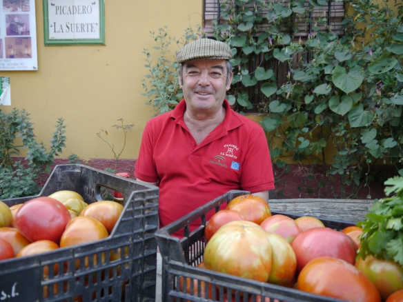 Iluminado showing off his bumper crop of tomatoes. Photo: Jan Nimmo ©